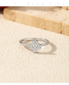 Close-up of S925 silver ring featuring a sparkling club clover design with pavé crystals