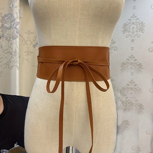 Brown wide PU leather corset belt with lace-up tie closure for dresses and skirts