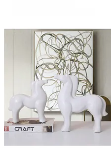 Minimalist white ceramic horse sculptures in a stylish Nordic home decor setting