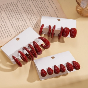 Six-piece set of deep red acrylic geometric C-shape earrings on jewelry display card