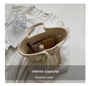Internal view of straw bucket bag showing large capacity for cosmetics and wallet