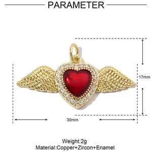 Macro detail of a 3D gold winged heart pendant with red enamel and zircon size dimensions