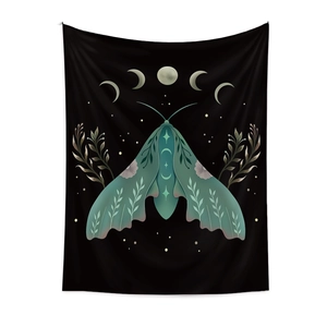 Bohemian black wall tapestry featuring a moth with botanical wings and lunar phases
