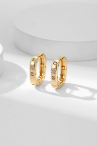 Detailed view of golden square hoop earrings with micro-pave cubic zirconia accents