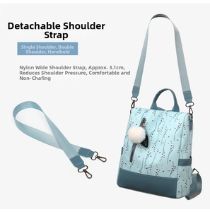 Detail showing a 3.1cm detachable wide shoulder strap for blue floral oxford backpack