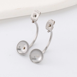Detail of stainless steel earring posts with cup base and butterfly backs for DIY jewelry