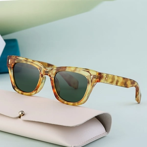 Classic polarized sports sunglasses with amber tortoiseshell frames and dark lenses