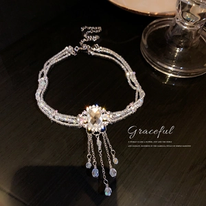 Choker multicouche en cristal exquis avec grand strass ovale et franges de glands