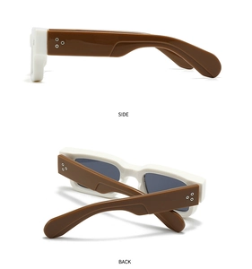 Detail view of white square sunglasses with silver gear rivets and dark grey lenses