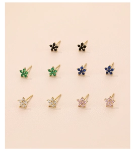 Detail of colorful petal stud earrings in black green blue white and pink zircon