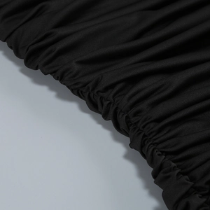 Macro detail of the elegant black pleated knitted fabric texture on the mermaid dress