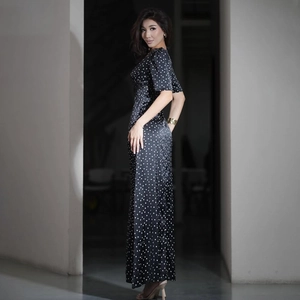 Detail of V-neck polka dot maxi dress in black silk fabric with short sleeves