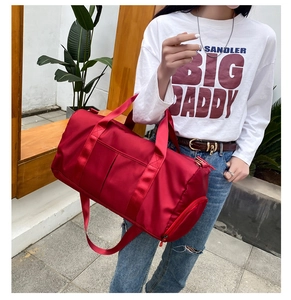 Red large capacity travel duffel bag with handles and adjustable shoulder strap for gym