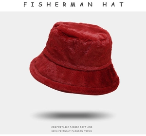 Detailed close-up showing the soft plush texture of the warm red fisherman hat