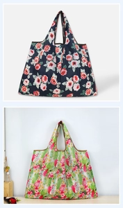 Detail of floral and flamingo patterns on foldable waterproof grocery shopping bags