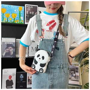 Close-up of a cute panda silicone crossbody bag with a patterned shoulder strap
