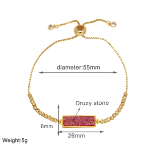 Detail showing red rectangular Druzy stone on a gold adjustable chain bracelet with dimensions