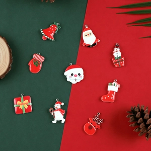 Nine Christmas alloy enamel charms featuring Santa and snowman for DIY holiday jewelry craft