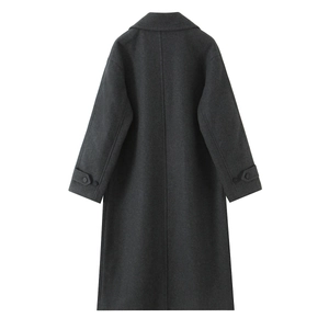 Detail view of charcoal gray wool coat back with center seam and sleeve strap buckles