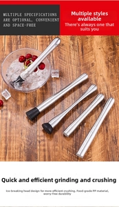 Macro detail of stainless steel cocktail muddlers with textured fruit crushing heads