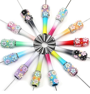 Detail of 12 gradient DIY beadable pens featuring resin 3D flowers and sparkling rhinestones