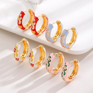 Vintage enamel hoop earrings with colorful floral oil drip patterns in four vibrant styles