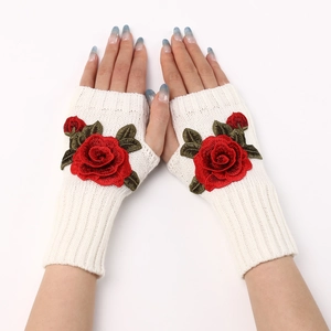 Detail of cream knitted fingerless gloves with red 3D rose flower embroidery craft