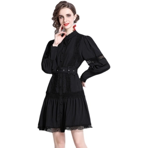 Elegant black lace patchwork dress with lantern sleeves and a waist-defining belt