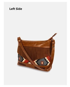 Side view of bohemian crossbody bag with brown tassels and ethnic jacquard pattern