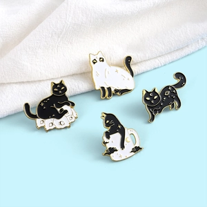 Set of four spooky Halloween black cat and ghost enamel pins with gold trim for clothing