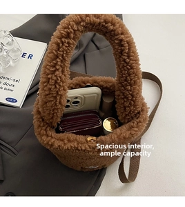 Top view of plush bucket bag showing spacious interior with magnetic closure and brown strap