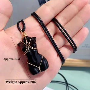 Natural black crystal female torso pendant with gold wire wrap on black cord, 4cm height