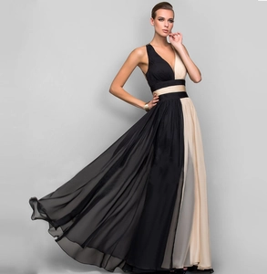 Detail of elegant V-neck sleeveless chiffon maxi dress with black and champagne color blocking