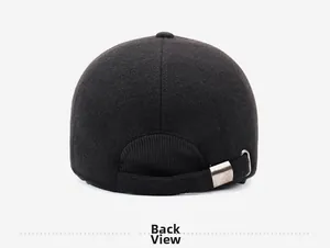 Detail of the back of a black baseball cap featuring an adjustable silver metal buckle