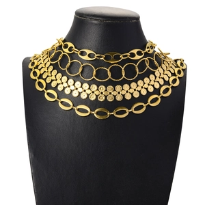 Multi-layer gold stainless steel chain necklace set featuring diverse link styles on mannequin