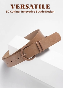 Detail of tan faux leather belt with round matching pin buckle and litchi texture
