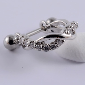 Macro shot of silver stainless steel cartilage stud earring with micro-pave zircons