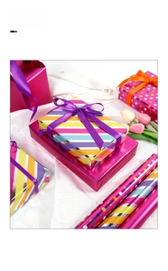Vibrant gift wrap set with colorful stripes and polka dots featuring matching silk ribbons