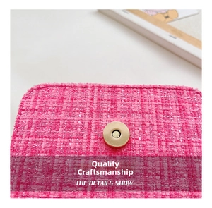 Macro detail of pink tweed fabric texture and high-quality gold magnetic metal buckle