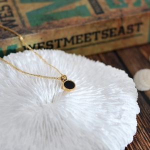18K gold plated necklace featuring a round black onyx pendant with delicate beaded edge