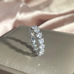 Detailed view of S925 sterling silver heart-shaped zircon ring on jewelry box