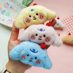 Three cute plush puppy dolls in yellow, pink and blue for hair accessories or brooches