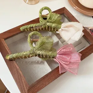 Elegant tulip hair claws in white and pink organza with green fabric wrapped metal grip