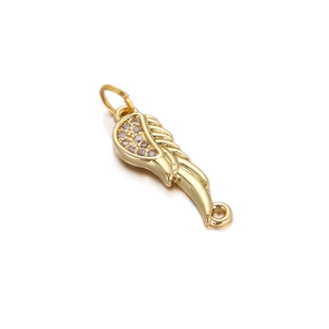 Macro detail of 18K gold-plated angel wing pendant with sparkling crystals and loops