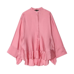 Pink satin blouse with ruffle hem and batwing sleeves in a professional flat lay view