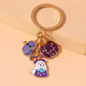 Detail of Halloween keychain with enamel charms of ghost, star pumpkin, and witch cauldron