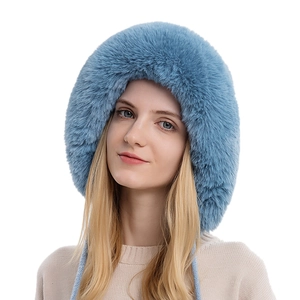 Women winter plush beanie in sky blue featuring fluffy faux fur and braided chin straps