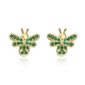 Detailed close-up of gold bee earrings with green zircon wings on a white background