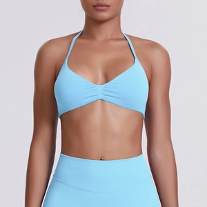Detailed side view of baby blue seamless halter neck sports bra and high waist leggings