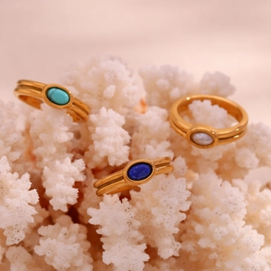 Detailed macro view of 18K gold plated striped rings with colorful natural stones
